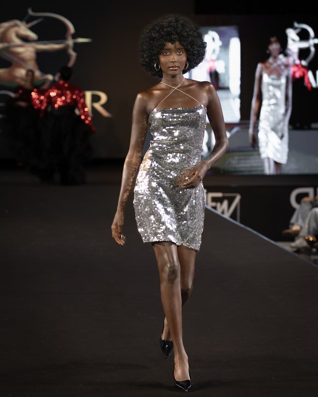 Model in a silver sequined dress