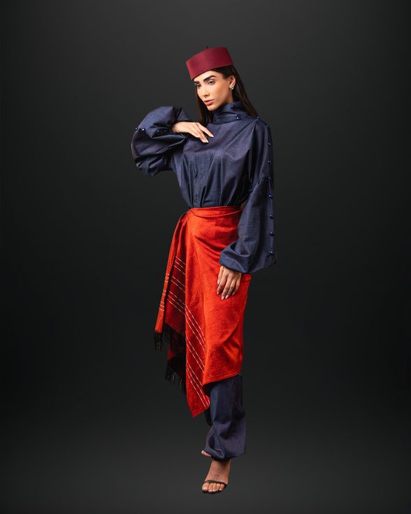 Model in navy and red with a headwrap