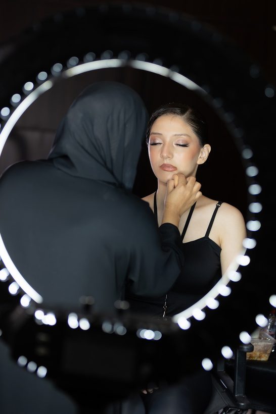 Model reflected in a ring-light mirror
